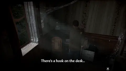 Game screenshot. Character stands in dark spooky room front of table. Comment: There's a book on the desk...